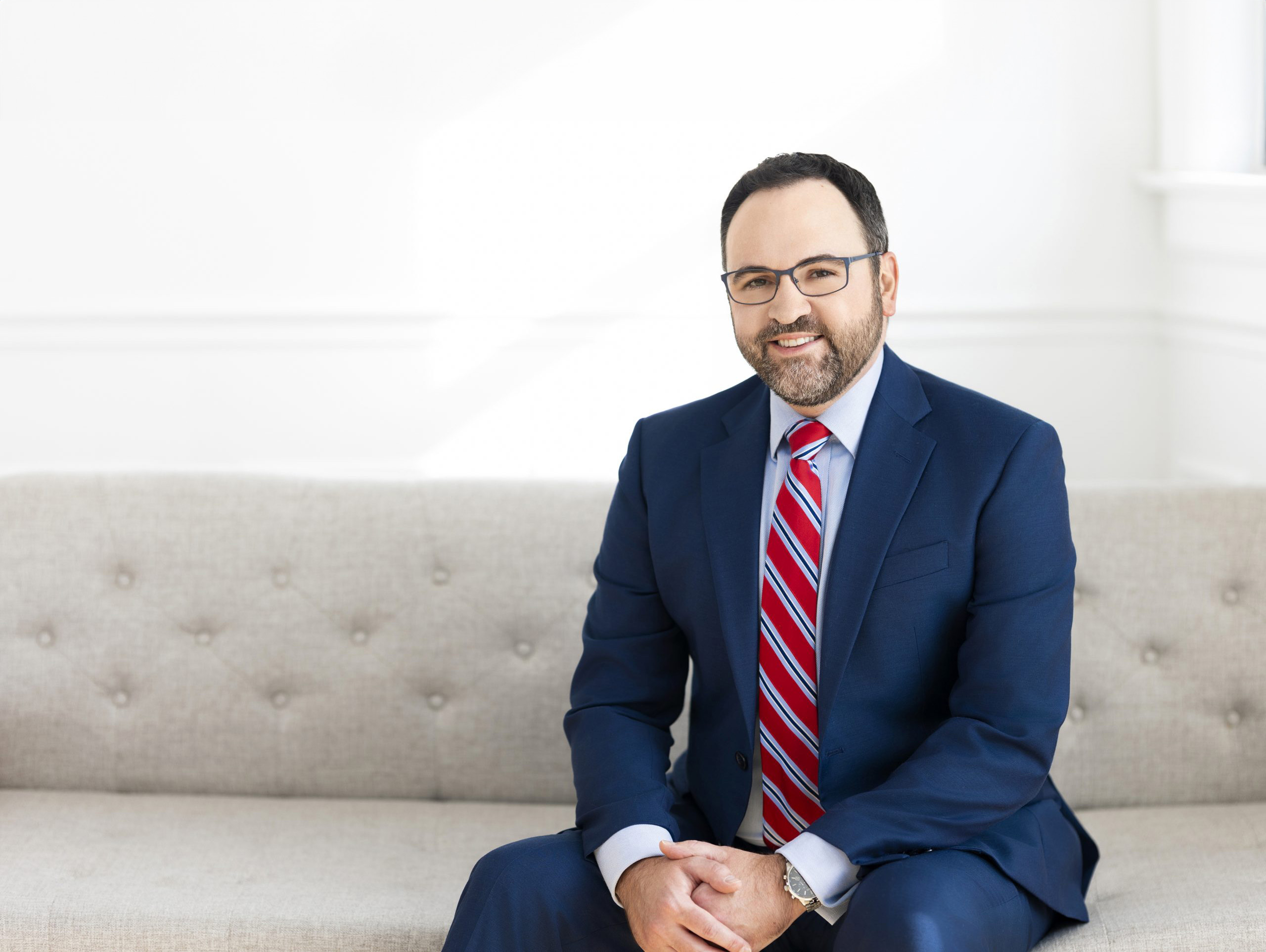 Peter G. Bissett sitting on a couch